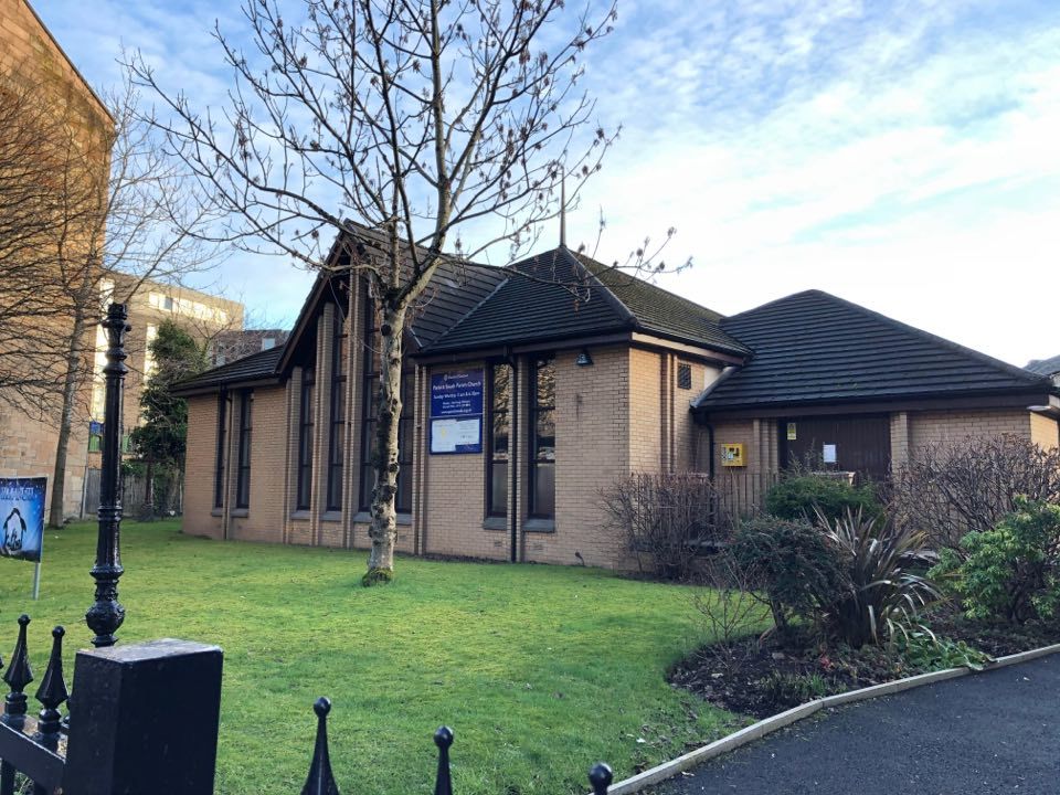 The church building on Dumbarton Road, with its lawn and tree in front